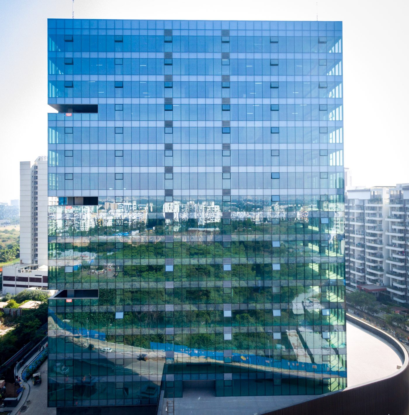 Drone inspection of glass curtain wall facade Pune — direct elevation view showing panel joints and glazing condition, AerialPhotoIndia