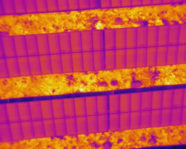 Drone thermal imaging showing heat anomalies — orange and yellow indicate faults invisible to visual inspection, AerialPhotoIndia thermography